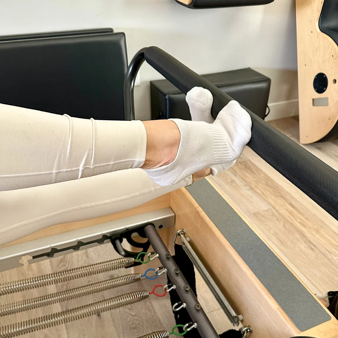 Close up of client's feet on the reformer
